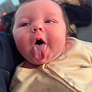 Ava joined the competition — help win amazing prizes! baby, blanket, cheeks, child, clothing, couch, cozy, cute, drool, expression, face, human, indoors, infant, onesie, person, portrait, soft, teddy_bear_pattern, tongue