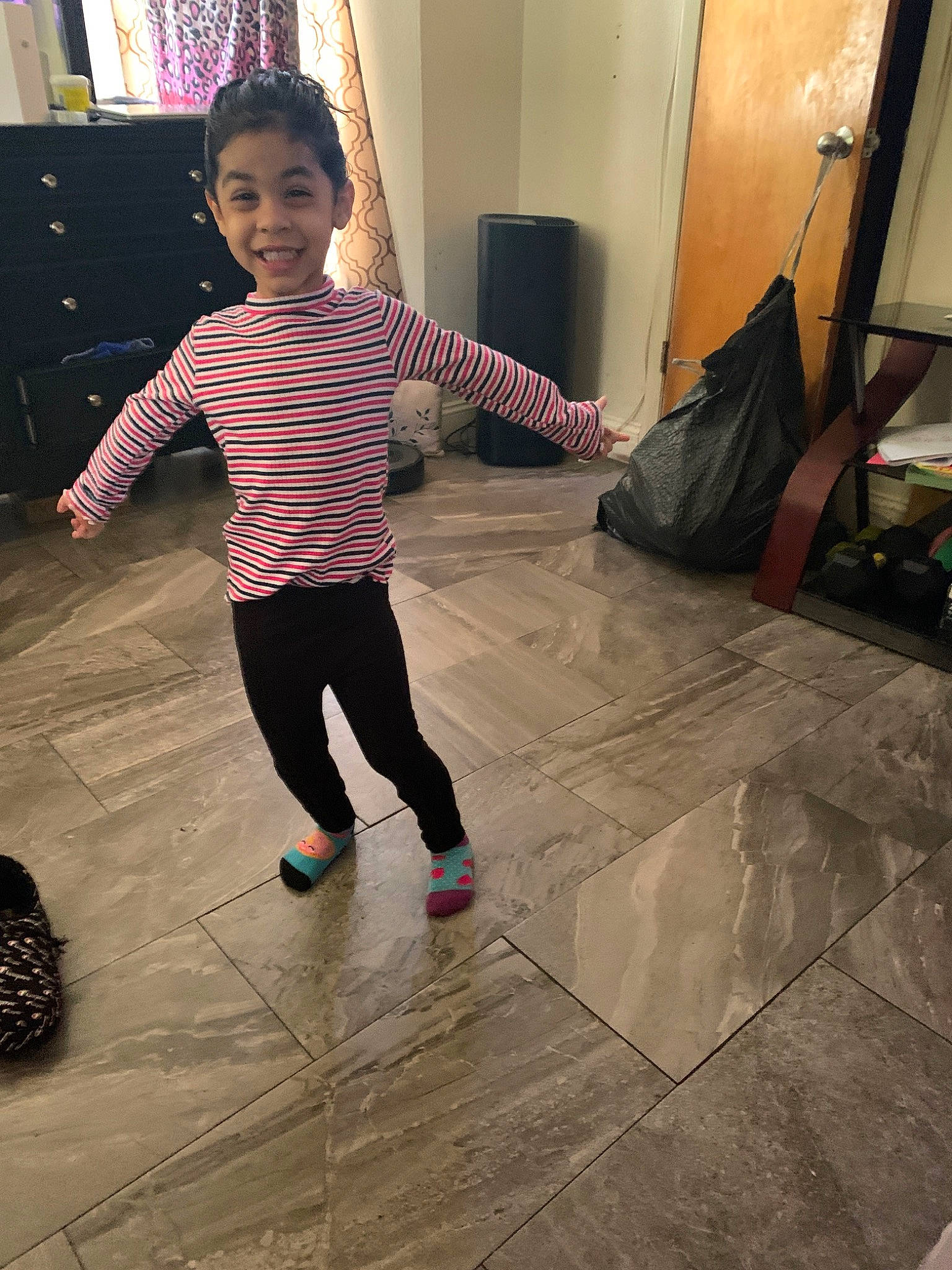 Cynthia is registered to the contest to win money with this photo: child, floor, flooring, joint, joy, leg, person, play, shoe, shoulder, standing, toddler