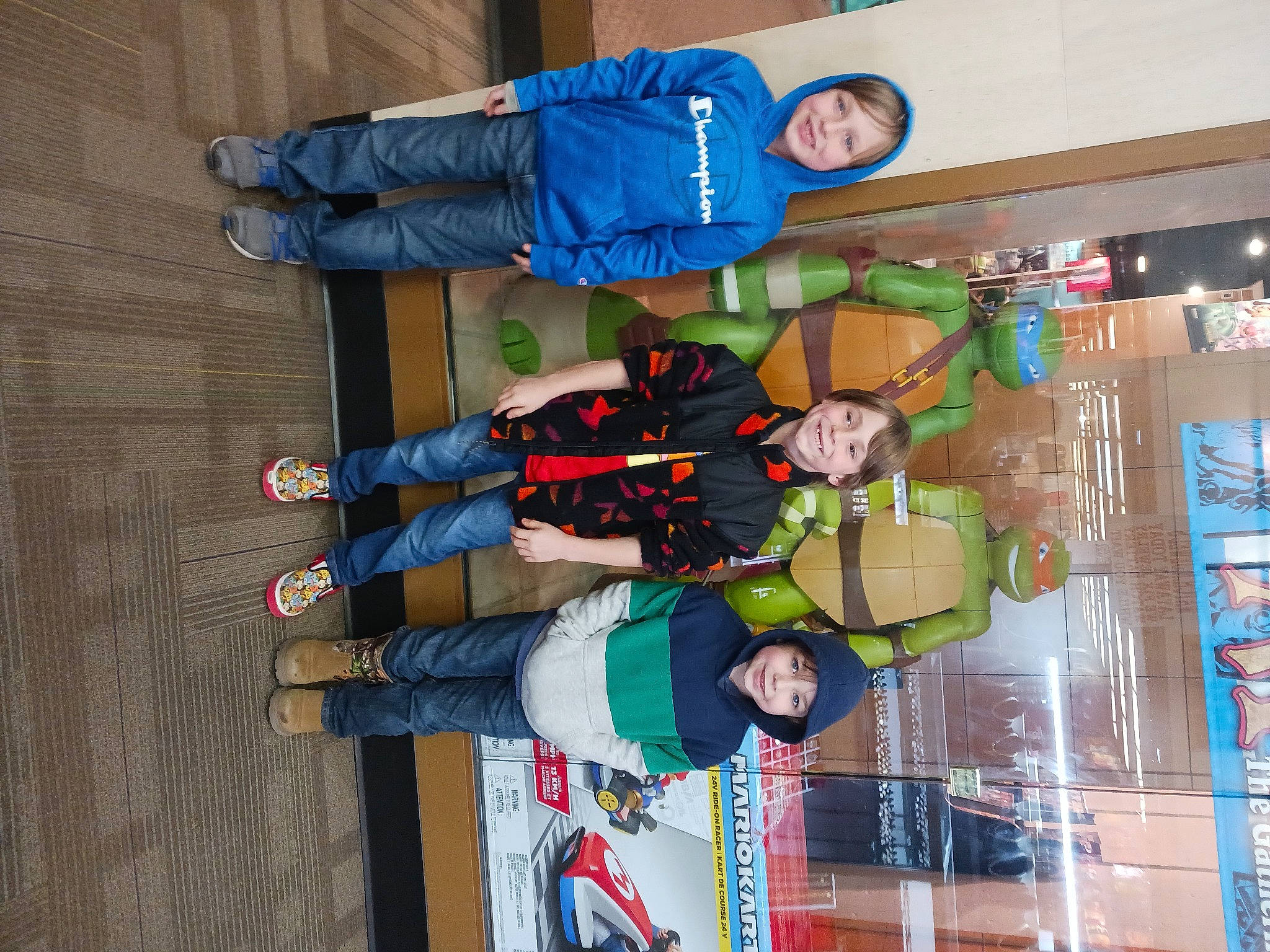 Sebastian is registered to the contest to win money with this photo: costume, electric_blue, event, fun, headwear, joy, machine, outdoor_shoe, person, recreation, smile, walking_shoe