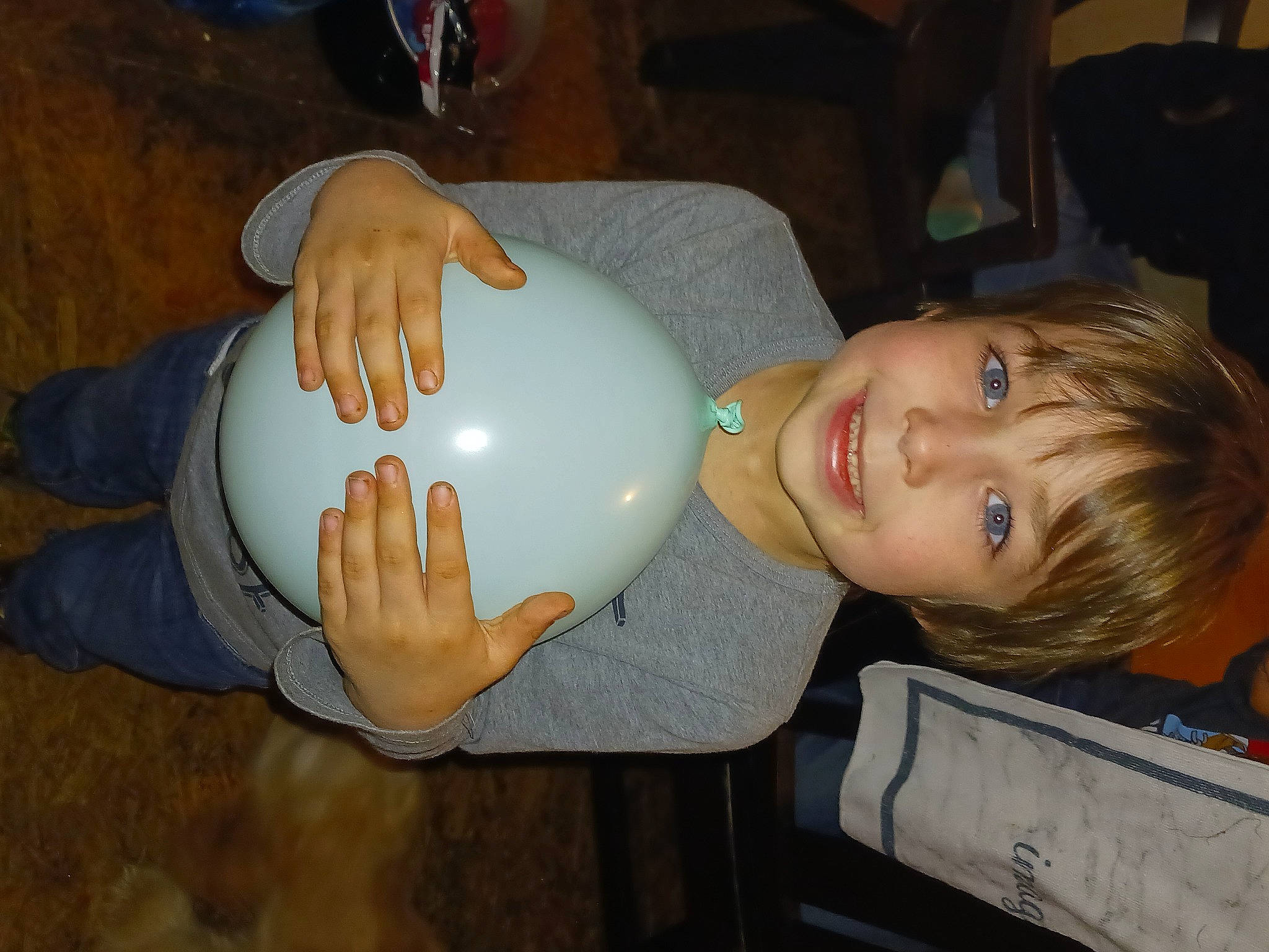 Gabriel is registered to the contest to win money with this photo: chair, child, drinkware, fun, gesture, helmet, joy, nail, party_supply, person, smile, thumb, toddler, wrist