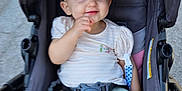 Kayden joined the competition — help win amazing prizes! baby, child, stroller, bow, headband, smile, barefoot, pants, shirt, seatbelt, pink_cushion, outdoor, playful, happy, person, infant, cute, face, portrait, baby_toddler