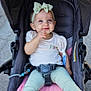 baby, child, stroller, bow, headband, smile, barefoot, pants, shirt, seatbelt, pink_cushion, outdoor, playful, happy, person, infant, cute, face, portrait, baby_toddler
