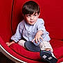 Devrane a rejoint le concours — aidez-le/la à gagner de superbes lots ! child, boy, sitting, red_chair, curious, indoor, clothing, shirt, pants, footwear, modern_furniture, playful, young, portrait, expression, hand, shoe, comfortable, casual, hair