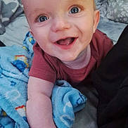 Slade joined the competition — help win amazing prizes! baby, smiling, blue_eyes, blanket, bed, infant, happy, cute, child, clothing, arm, hand, face, portrait, indoor, expression, skin, person, young, toddler