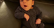 Malcolm joined the competition — help win amazing prizes! baby, couch, cozy, cute, face, homedecor, indoors, infant, leather_couch, low_light, mouth_open, newborn, onesie, portrait, seated, sitting, small_hand, soft_skin, stitching, yawning