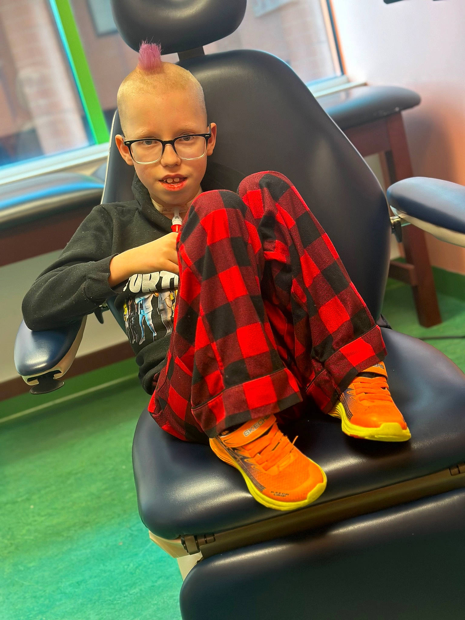 Carson joined the competition — help win amazing prizes! audio_equipment, automotive_design, carmine, chair, comfort, eyewear, fun, furniture, grass, human_leg, knee, leisure, pattern, person, personal_protective_equipment, plaid, recreation, sitting, snapshot, sports_gear