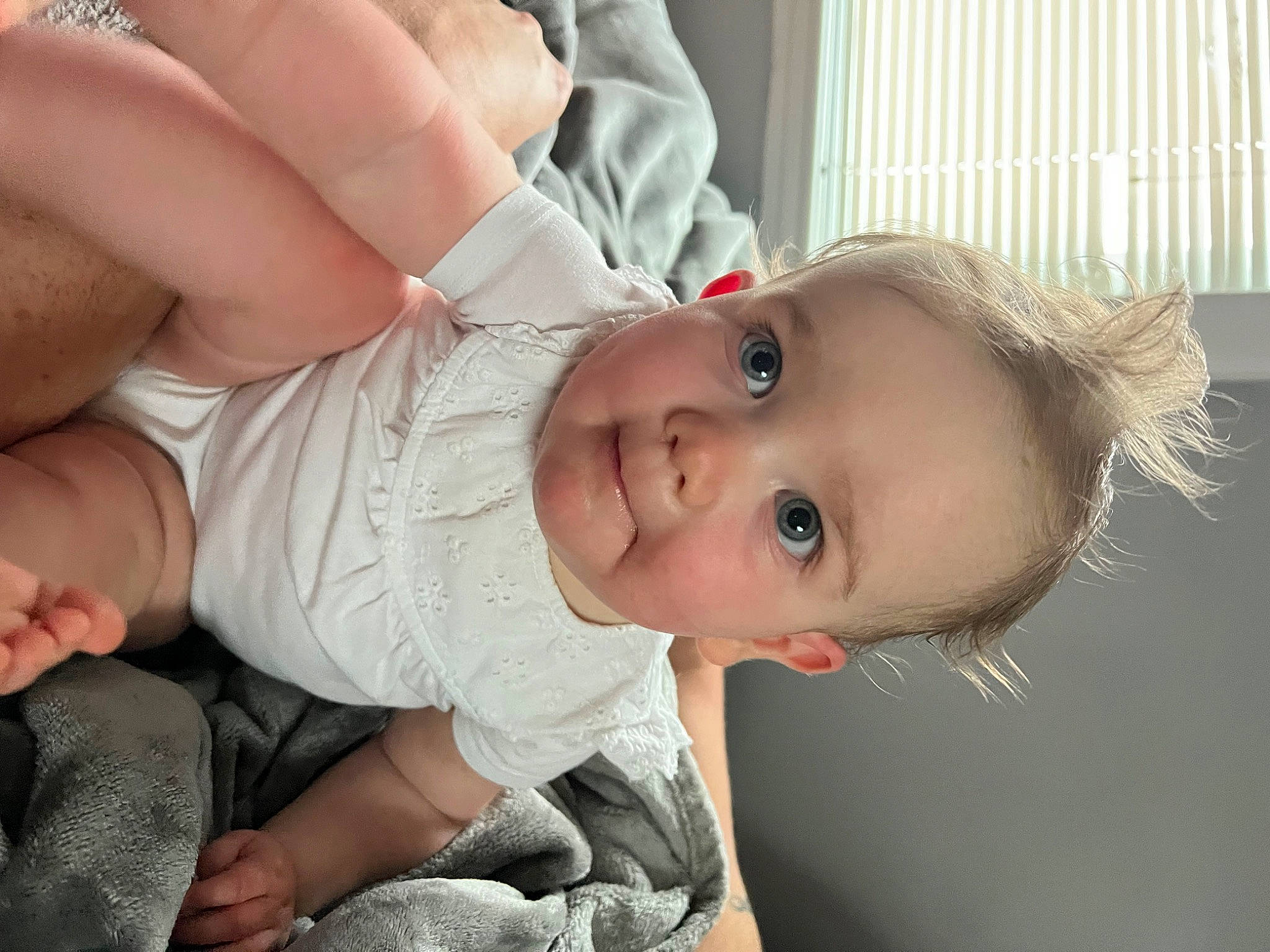 Sadie is registered to the contest to win money with this photo: baby, baby_toddler_clothing, cheek, child, comfort, gesture, hair, hand, happy, human_body, iris, joint, joy, lip, mouth, neck, nose, person, skin, sleeve