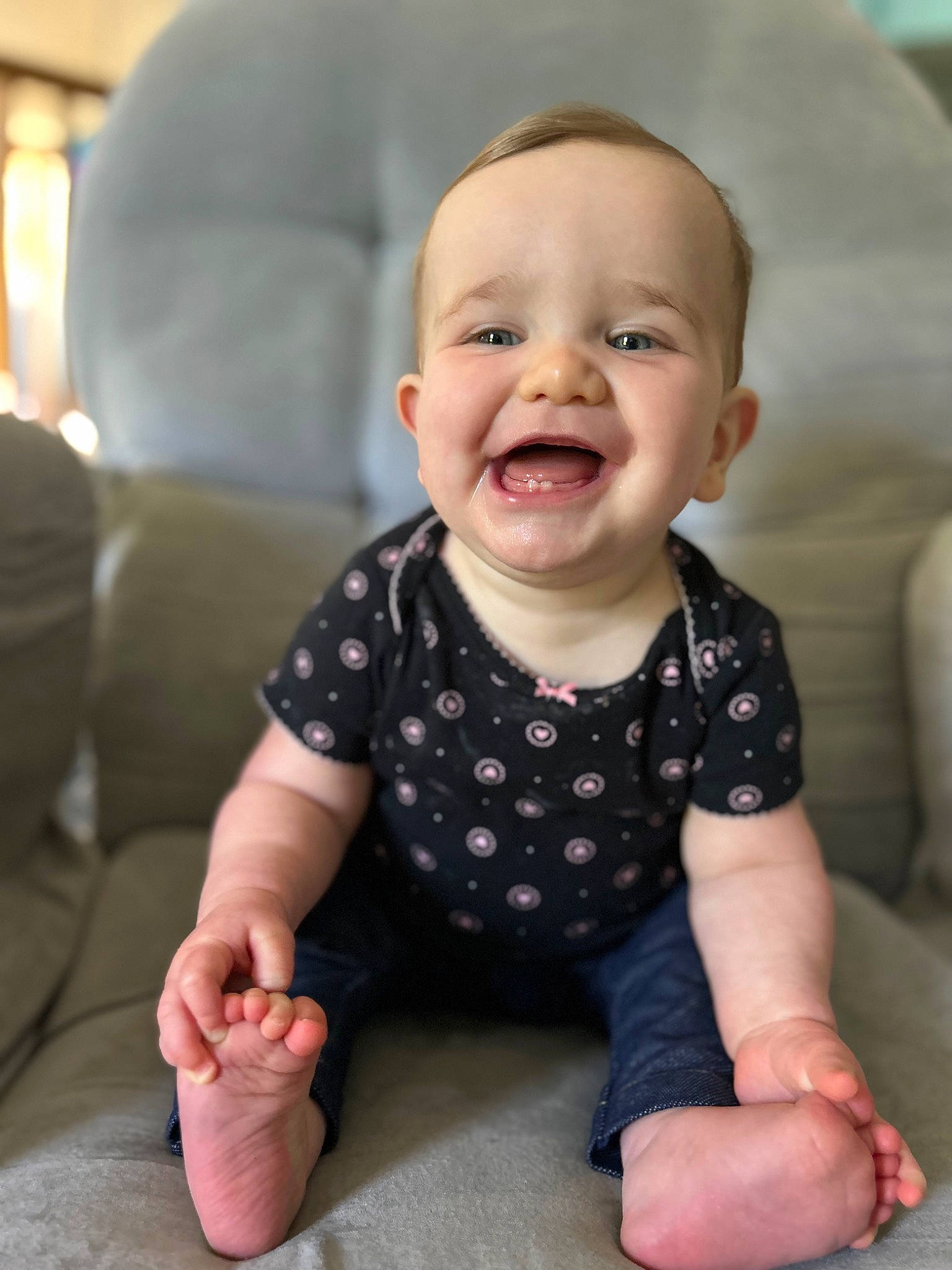 Sadie is registered to the contest to win money with this photo: baby, baby_toddler_clothing, cheek, chin, comfort, eye, facial_expression, finger, flooring, gesture, happy, iris, joy, mouth, neck, nose, person, skin, sleeve, smile