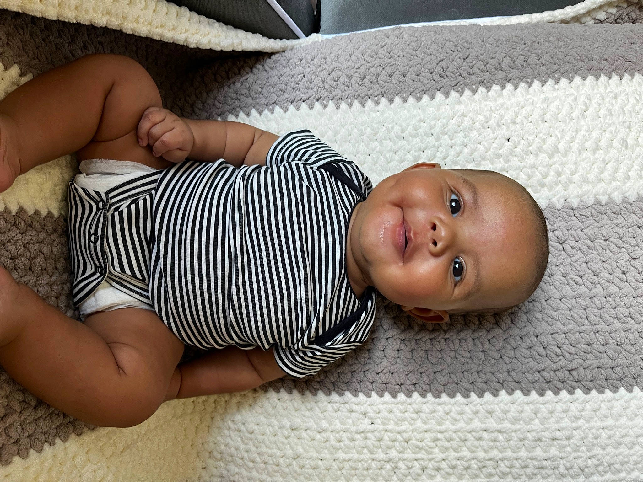 Arden joined the competition — help win amazing prizes! baby, baby_sleeping, baby_toddler_clothing, child, comfort, elbow, finger, flooring, human_leg, linens, pattern, person, room, sitting, skin, sleeve, thigh, toddler, white, wood