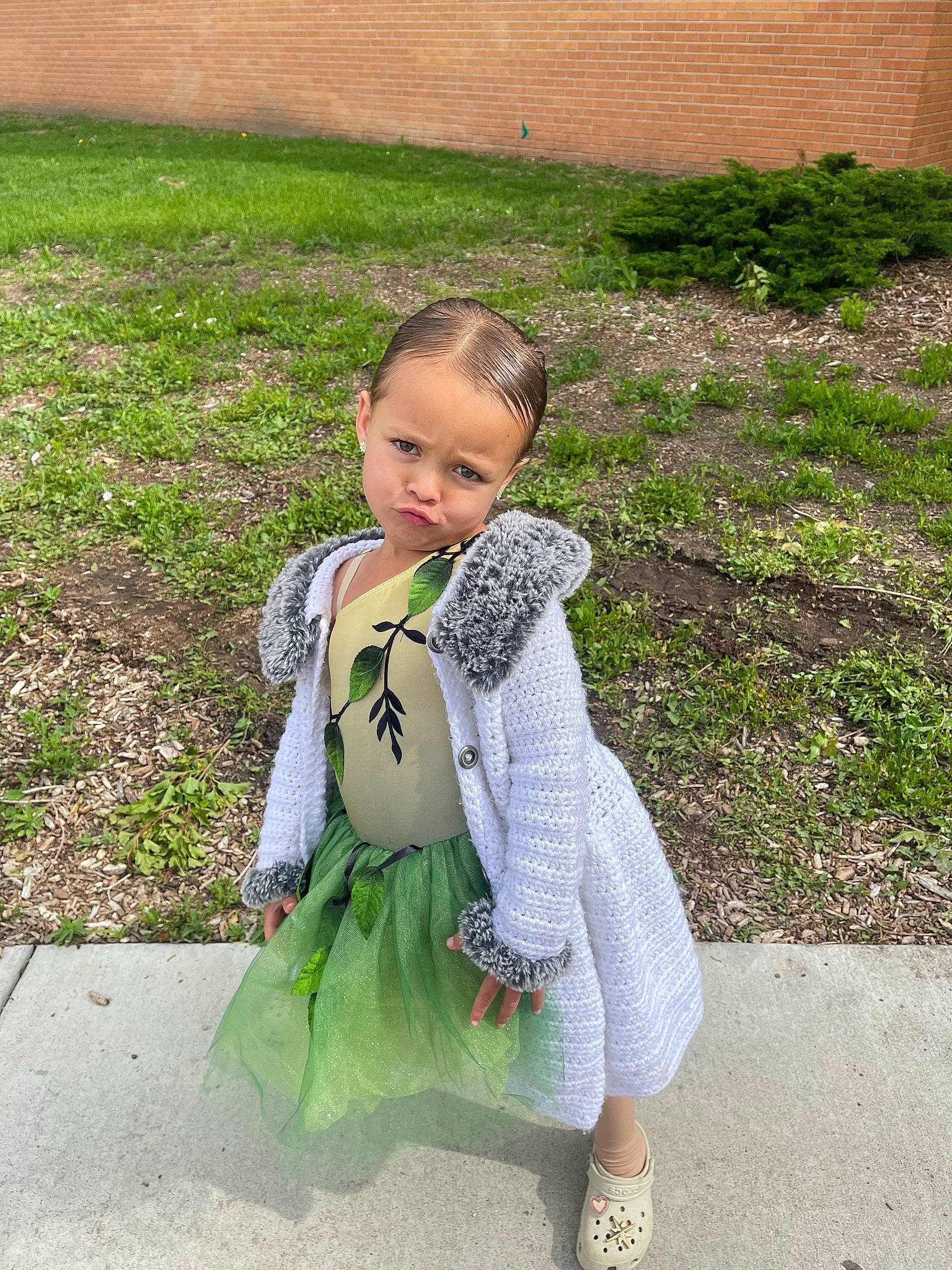 Amora is registered to the contest to win money with this photo: baby, baby_products, baby_toddler_clothing, child, fur, garden, grass, grass_family, leg, leisure, pattern, people_in_nature, person, sandal, sitting, sleeve, sorrow, toddler, toy, vacation