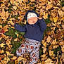 Ryker joined the competition — help win amazing prizes! baby, child, autumn, fall_leaves, grass, sleeping, hoodie, hat, pants, football_pattern, blue_socks, outdoor, nature, leaves, seasonal, cute, peaceful, infant, relaxing, portrait