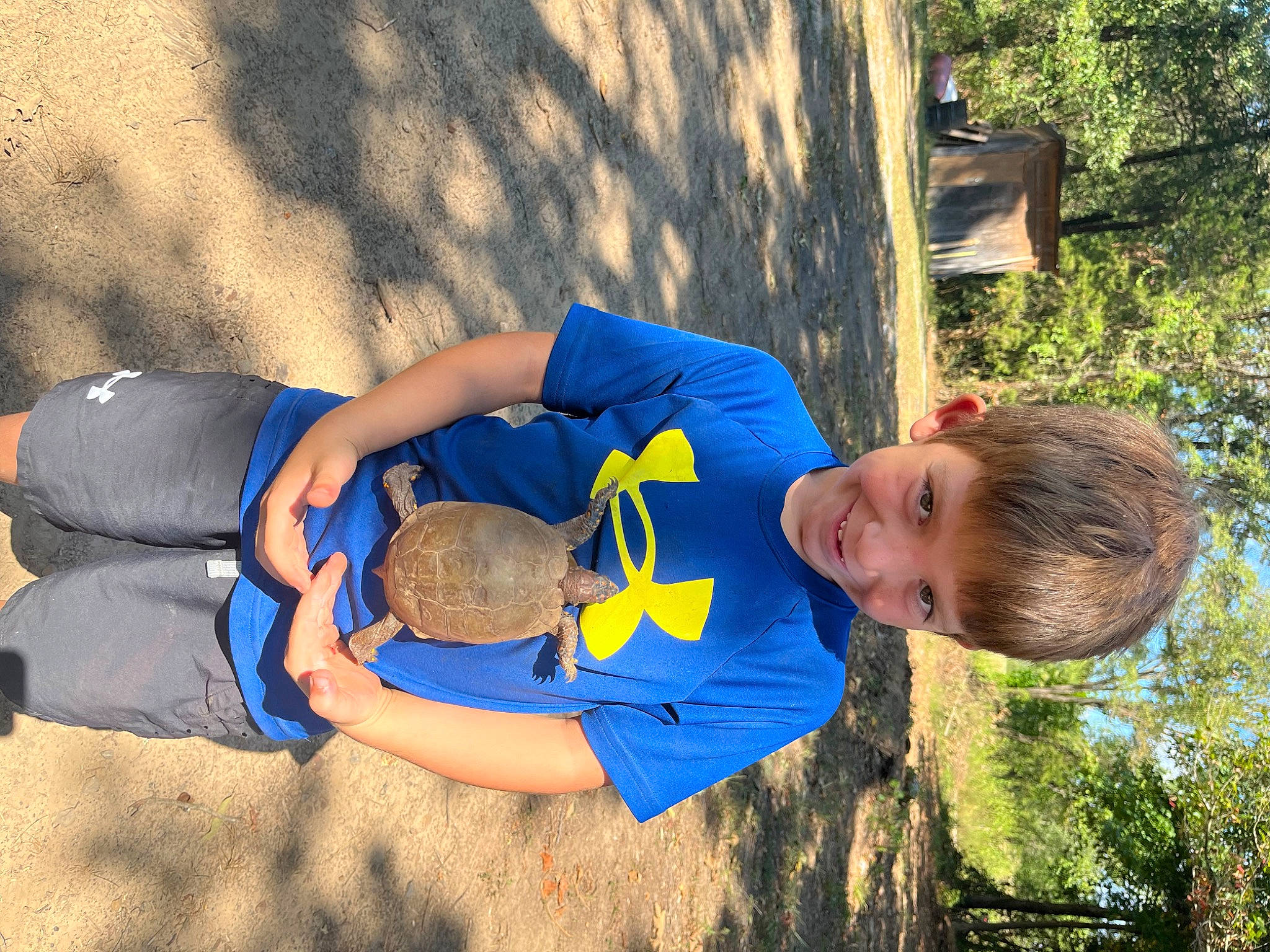 Lynnox is registered to the contest to win money with this photo: arm, child, elbow, electric_blue, fun, gesture, grass, happy, human_leg, joint, joy, knee, leisure, people_in_nature, person, plant, play, shorts, t_shirt, thigh