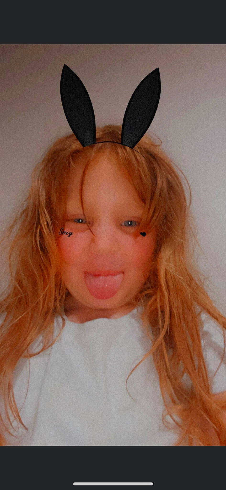 Evalynn is registered to the contest to win money with this photo: bangs, cheek, costume_hat, ear, eyelash, fashion_accessory, happy, head, headpiece, jaw, joy, lip, long_hair, mythical_creature, nose, peach, person, sleeve, smile, toddler