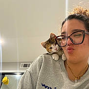 Tina joined the competition — help win amazing prizes! casual, cat, curly_hair, cute, facial_expression, glasses, hair, home, indoor, kitten, mirror, necklace, pet, pout, reflection, selfie, shoulder, sweatshirt, vent, woman