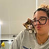 casual, cat, curly_hair, cute, facial_expression, glasses, hair, home, indoor, kitten, mirror, necklace, pet, pout, reflection, selfie, shoulder, sweatshirt, vent, woman