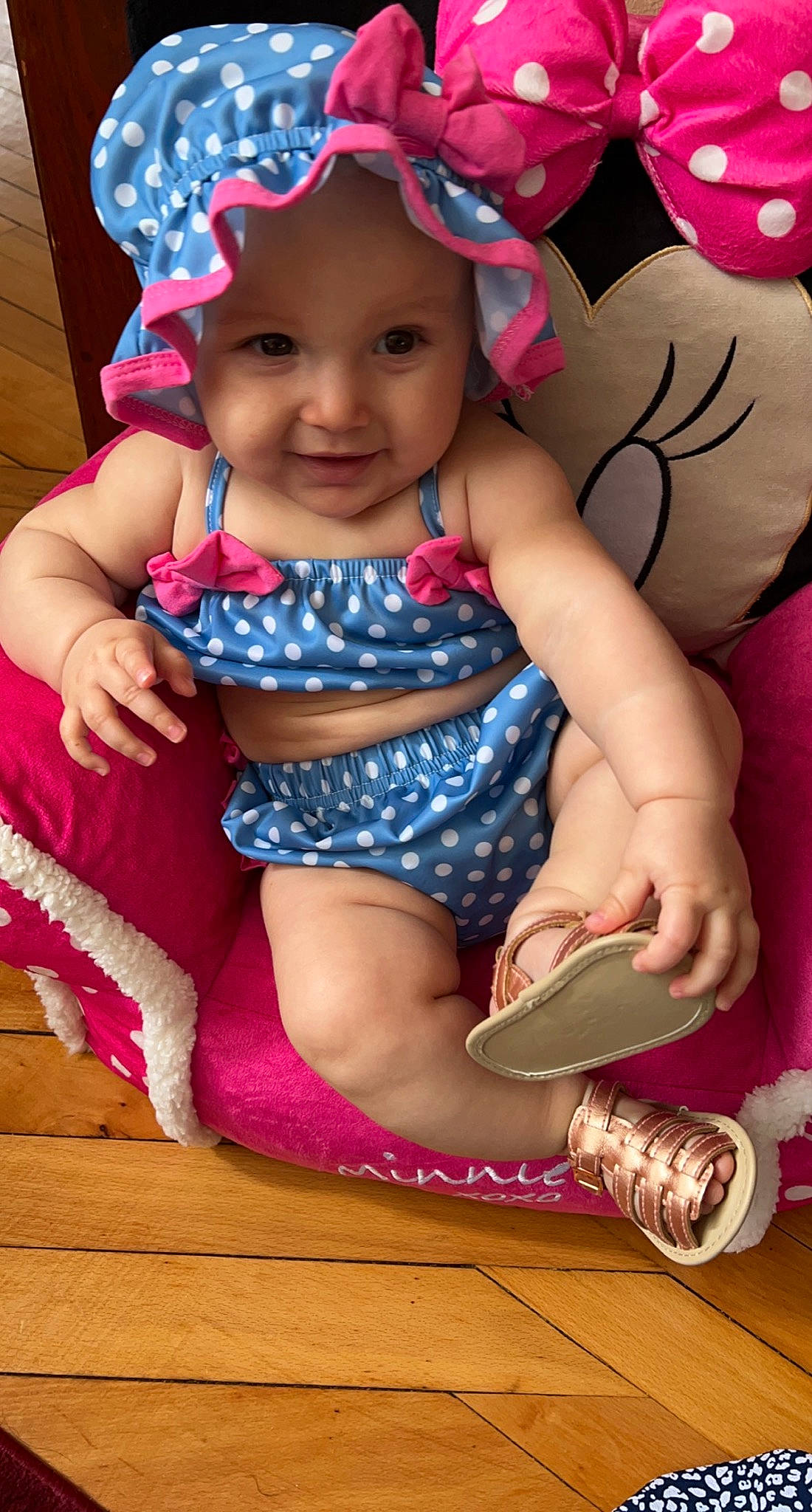 Liliana is registered to the contest to win money with this photo: baby, baby_toddler_clothing, cap, cheek, child, face, fun, happy, hat, headgear, headwear, joy, leg, magenta, pattern, person, pink, purple, skin, smile