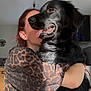 Ava participe au concours pour gagner de l'argent avec cette photo : affection, animal, black_dog, casual_clothing, close_up, companion, dog, friendly, home, hug, indoor, kitchen, leopard_print, love, person, pet, portrait, smiling, tongue_out, warm_light