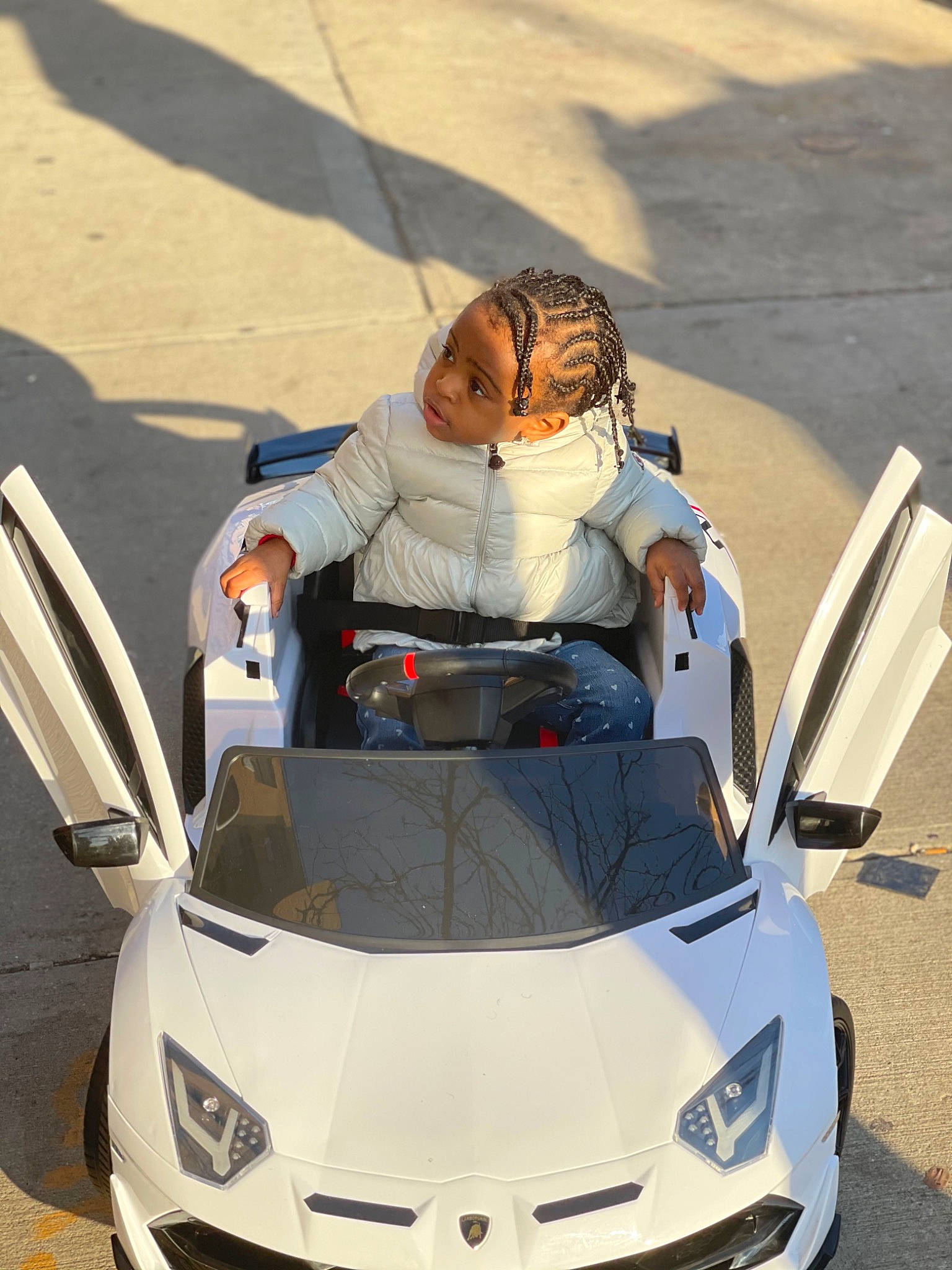 Lashawn joined the competition — help win amazing prizes! asphalt, automotive_design, automotive_exterior, automotive_fog_light, automotive_lighting, blue, bumper, car, eyewear, grille, headlamp, hood, light, motor_vehicle, person, personal_luxury_car, photograph, sunglasses, vehicle, white