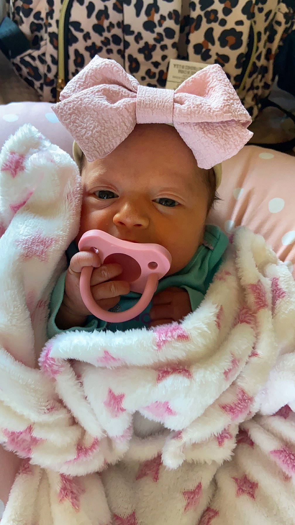 Aubriella is registered to the contest to win money with this photo: baby, baby_safety, baby_sleeping, baby_toddler_clothing, cheek, child, comfort, event, facial_expression, happy, human, linens, lip, mouth, nose, person, pink, skin, smile, textile