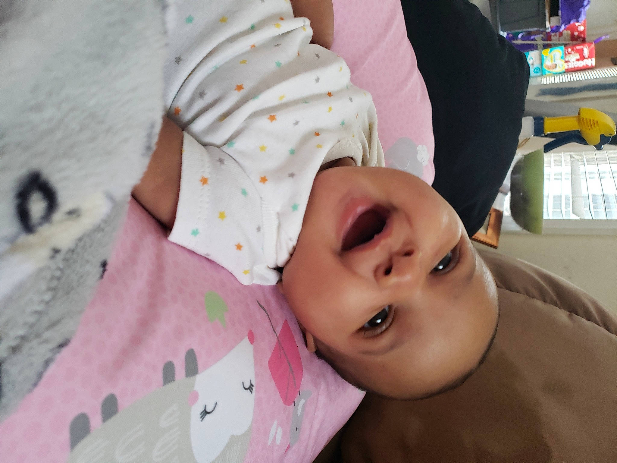 Harmony Rose is registered to the contest to win money with this photo: baby, baby_products, baby_toddler_clothing, cheek, child, eyelash, fun, happy, lip, nose, pattern, person, pink, portrait_photography, product, shelf, skin, sleeve, smile, toddler
