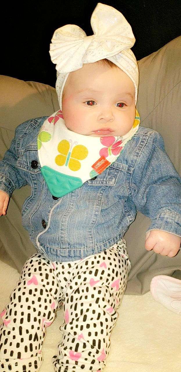 Zayanna joined the competition — help win amazing prizes! baby, baby_products, baby_toddler_clothing, child, design, headgear, outerwear, pattern, person, pink, polka_dot, product, sleeve, textile, toddler