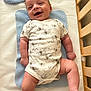 Asher joined the competition — help win amazing prizes! baby, infant, crib, blue_mat, onesie, elephant_print, smiling, happy, lying_down, wooden_crib, face, arm, leg, skin, child, cute, indoors, baby_clothing, newborn, baby_gesture