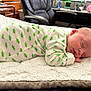 Asher joined the competition — help win amazing prizes! baby, sleeping, infant, onesie, dinosaur_pattern, blanket, bed, soft_texture, indoor, furniture, office_chair, desk, peaceful, cute, child, resting, head, face, hand, closeup