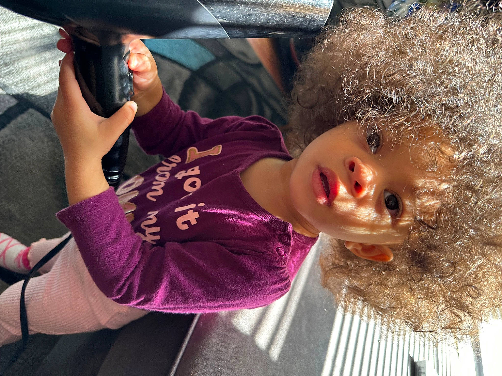 Mehlanii Brooklyn is registered to the contest to win money with this photo: automotive_exterior, baseball_cap, bumper, cap, car, child, eyewear, family_car, fashion_accessory, fun, fur, hat, headgear, magenta, person, personal_protective_equipment, t_shirt, tire, toddler, vehicle_door