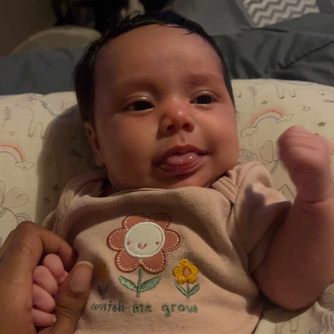 Elowyn is registered to the contest to win money with this photo: baby, bed, blanket, bodypart, clothing, couch, crib, cushion, face, finger, furniture, hand, head, homedecor, infantbed, newborn, person, photography, portrait, t_shirt