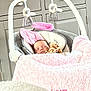 baby, sleeping, blanket, pink, soft_toy, rocker, infant, indoor, cabinet, frame, decor, cozy, child, nursery, resting, comfort, home, furniture, toddler, peaceful