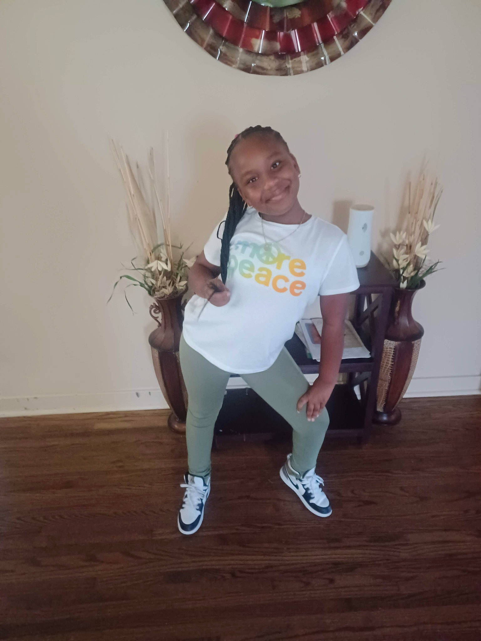 Kaitlyn is registered to the contest to win money with this photo: event, fashion_accessory, flooring, fun, happy, hardwood, human_leg, joy, knee, leg, lighting, party_supply, person, plant, room, smile, sportswear, t_shirt, thigh, umbrella