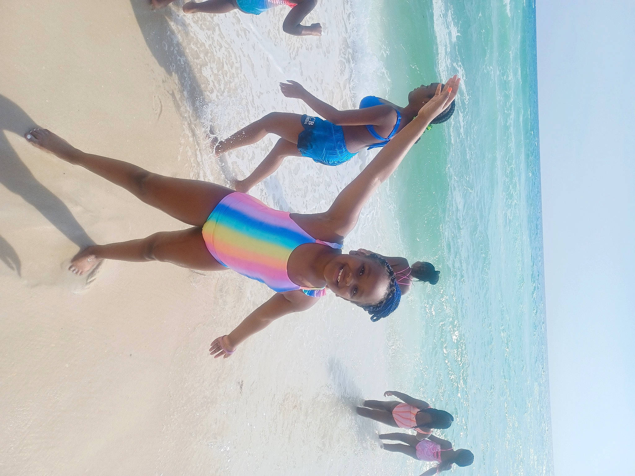 Kaitlyn is registered to the contest to win money with this photo: azure, barefoot, beach, elbow, foot, fun, happy, human_leg, joy, knee, leg, leisure, people_on_beach, person, recreation, shorts, summer, swimsuit_top, swimwear, thigh