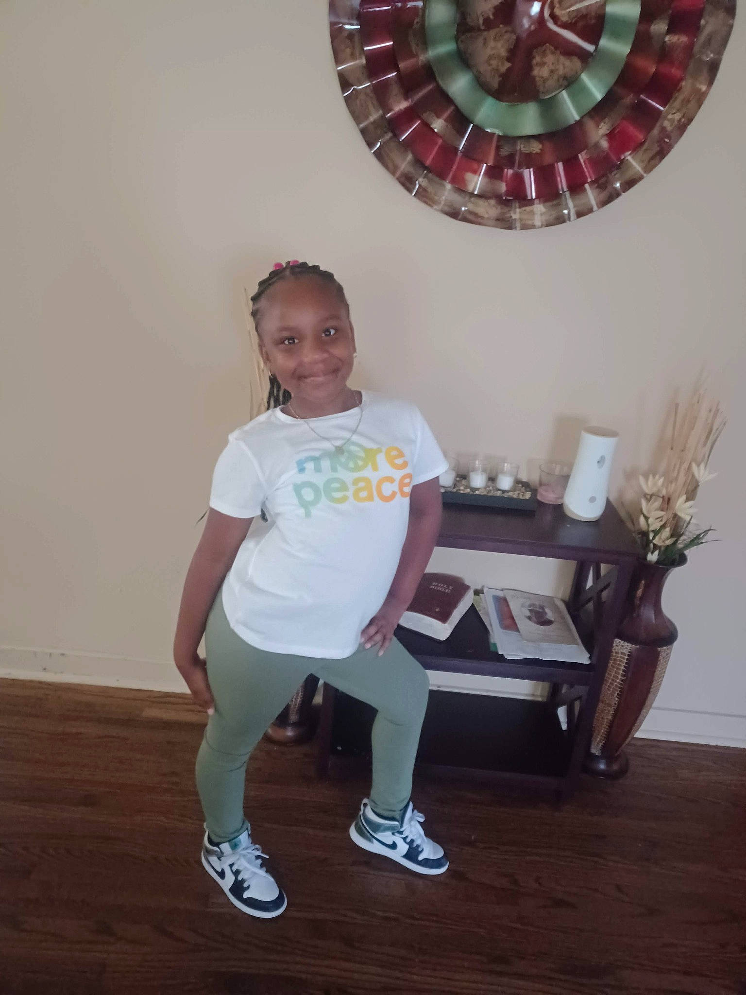 Kaitlyn joined the competition — help win amazing prizes! ceiling, child, circle, fashion_accessory, flooring, fun, happy, home_accessories, human_leg, joy, knee, lamp, lighting_accessory, magenta, person, room, shorts, smile, sweatpant, t_shirt