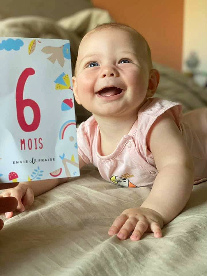 Alba participe au concours pour gagner de l'argent avec cette photo : baby, baby_toddler_clothing, beauty, cheek, dress, face, facial_expression, finger, flooring, fun, hand, happy, joy, people, person, pink, product, skin, sleeve, smile