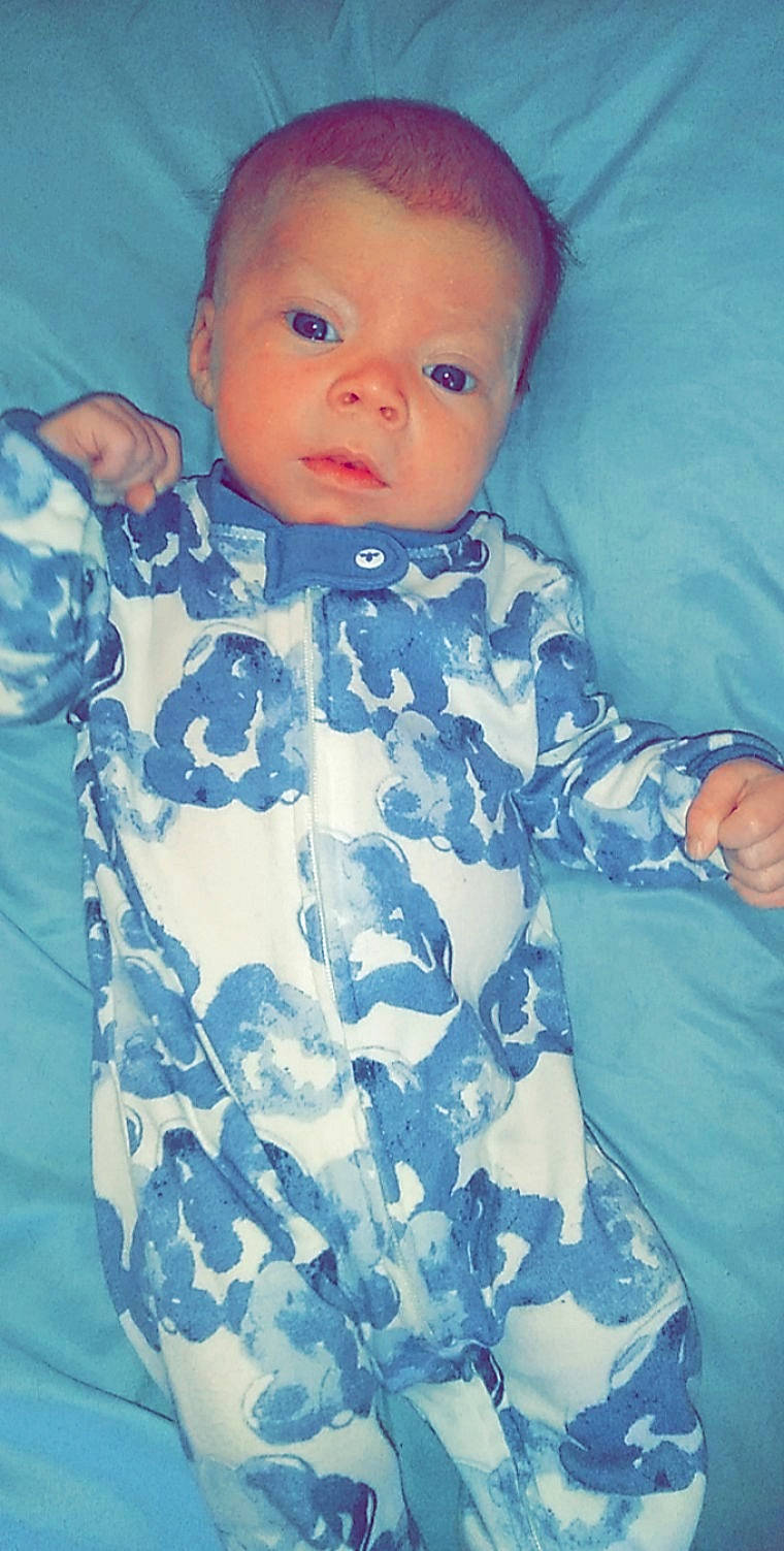 Kristoph is registered to the contest to win money with this photo: aqua, azure, baby, baby_toddler_clothing, camouflage, cheek, child, collar, electric_blue, eye, face, head, iris, military_camouflage, neck, pattern, person, skin, sleeve, t_shirt