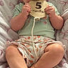 Raelynn joined the competition — help win amazing prizes! baby, infant, child, sitting, chewing, wooden_sign, 5_months, blanket, pink_bows, clothing, shorts, cute, smiling, hands, feet, indoors, portrait, soft_lighting, expression, young
