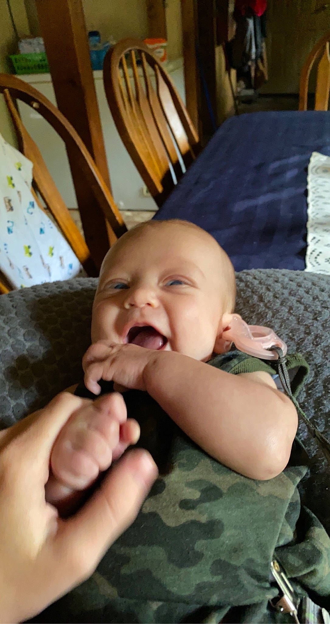 Briar is registered to the contest to win money with this photo: baby, baby_toddler_clothing, cheek, child, comfort, eye, eyebrow, finger, gesture, hand, happy, head, human_body, iris, nose, person, product, skin, smile, thumb