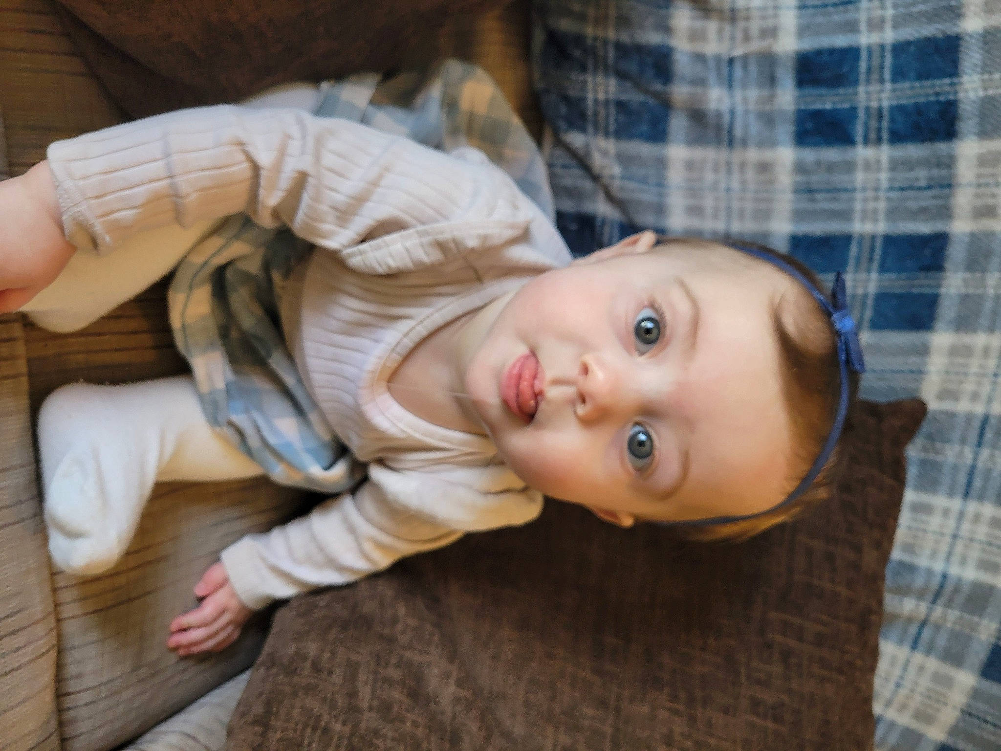 Sadie joined the competition — help win amazing prizes! baby, baby_toddler_clothing, cheek, child, comfort, flooring, fur, hardwood, nose, pattern, person, plaid, portrait_photography, sitting, skin, sleeve, tartan, toddler, wood