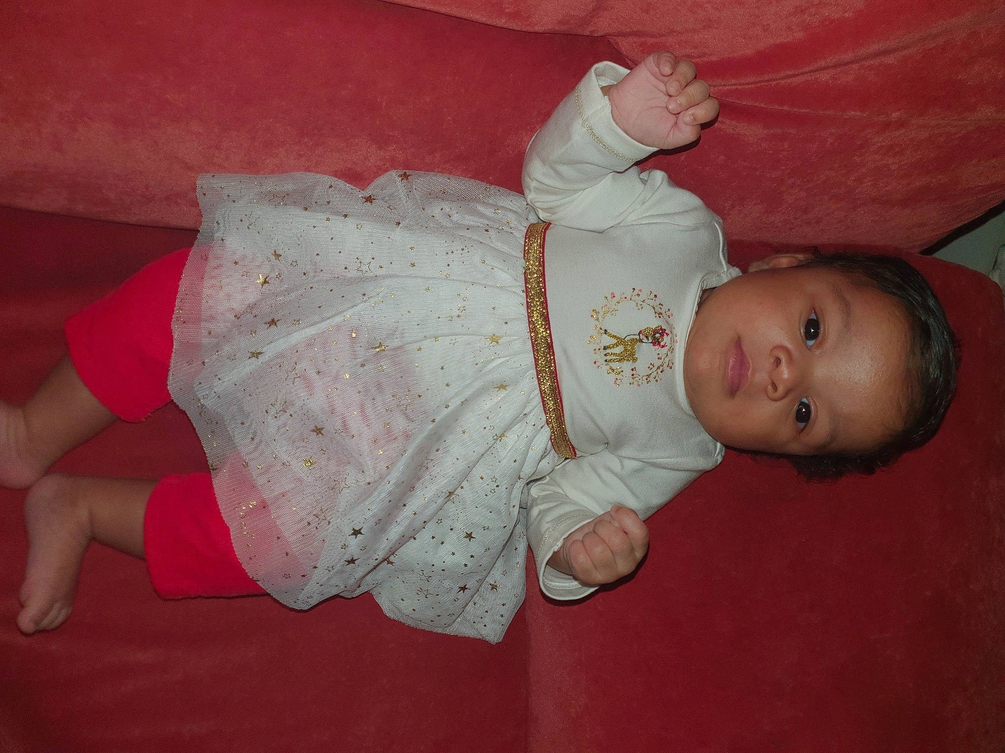 Lovaynna participe au concours pour gagner de l'argent avec cette photo : baby, baby_products, baby_toddler_clothing, cheek, child, comfort, embellishment, finger, flooring, head, iris, lap, pattern, peach, person, pink, room, sitting, sleeve, toddler