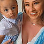 Kobie is registered to the contest to win money with this photo: baby, child, closeup, clothing, cute, eyewear, face, fashion, hand, happy, holding, indoor, looking, necklace, people, person, portrait, skin, smile, woman