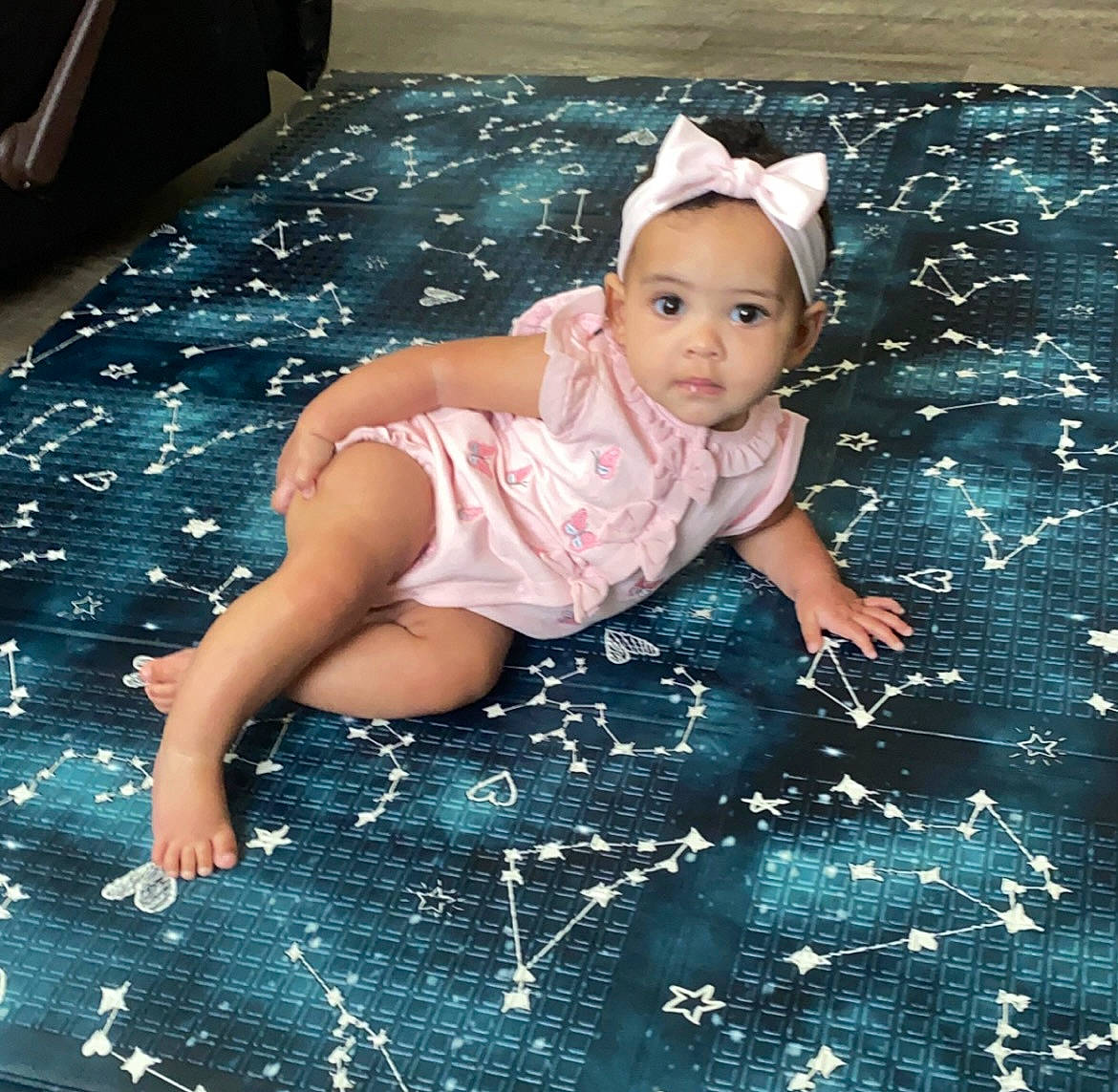 Davina is registered to the contest to win money with this photo: baby, baby_products, baby_toddler_clothing, child, cool, electric_blue, face, fashion_accessory, flash_photography, floor, flooring, fun, grass, happy, leisure, linens, pattern, person, play, sitting