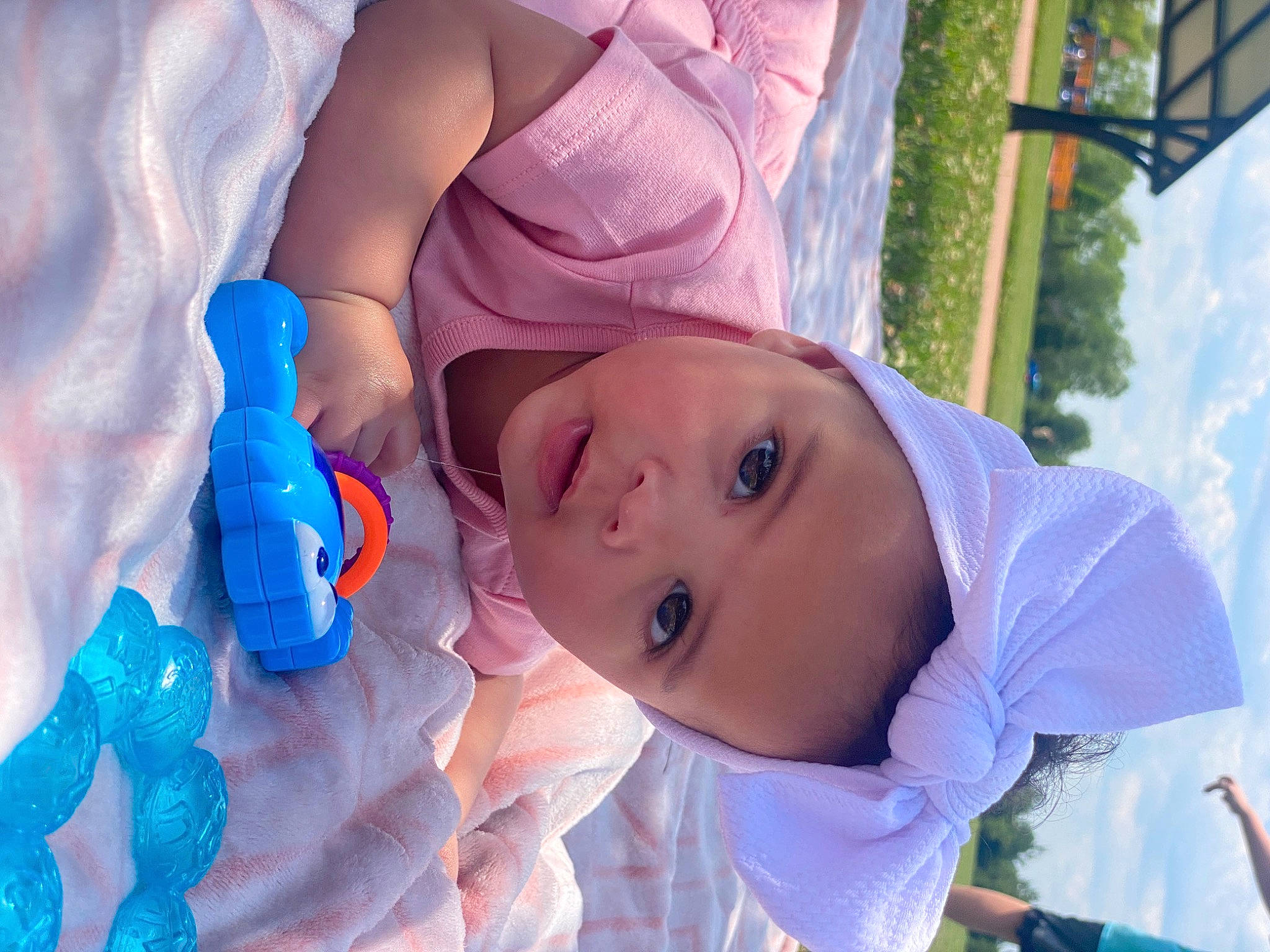 Davina is registered to the contest to win money with this photo: azure, baby, baby_toddler_clothing, blue, eyelash, facial_expression, finger, gesture, happy, hat, iris, mouth, nose, person, pink, plant, product, purple, skin, toddler