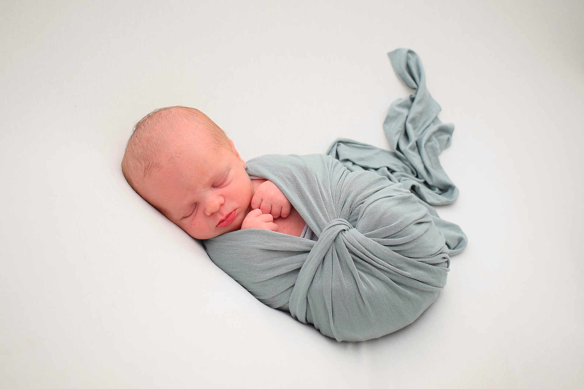 Theo joined the competition — help win amazing prizes! newborn, baby, sleeping, wrapped, blanket, soft, peaceful, infant, cute, resting, portrait, child, tied, fabric, cozy, head, face, skin, hands, white_background