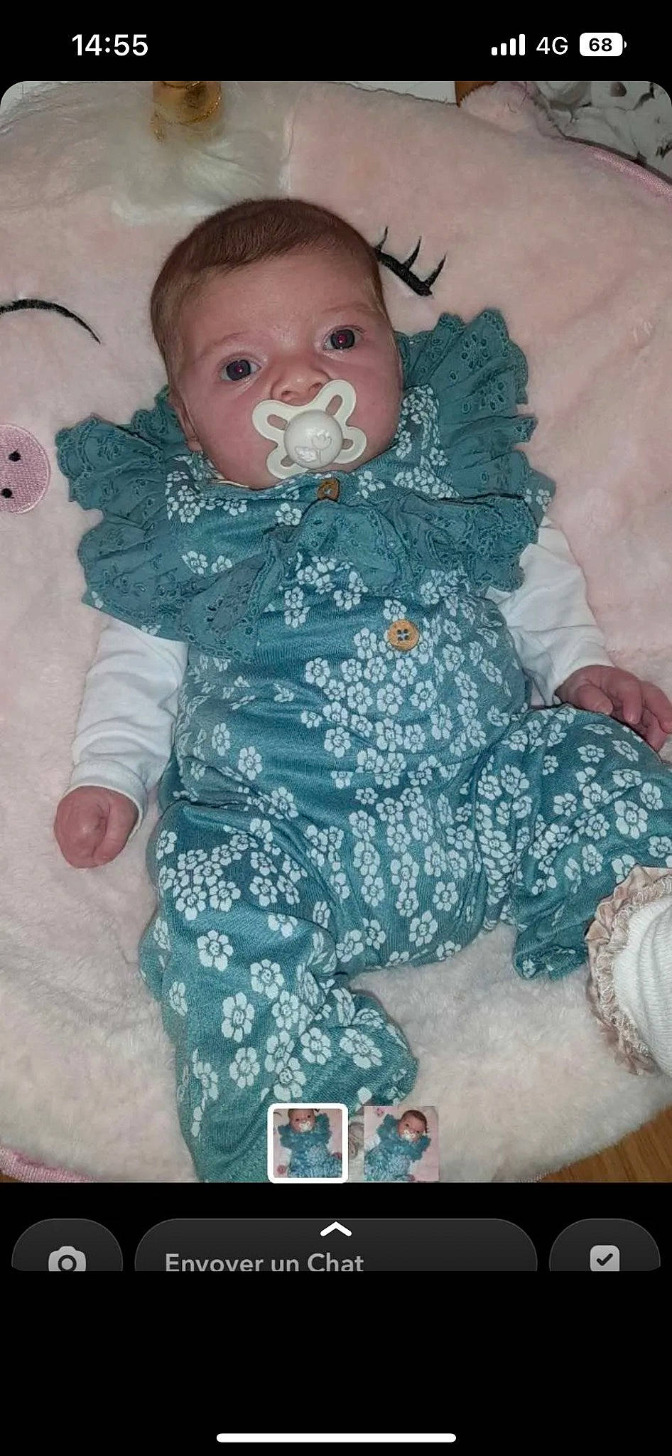 Eily participe au concours pour gagner de l'argent avec cette photo : baby, baby_products, baby_toddler_clothing, cheek, child, comfort, doll, face, fashion_design, font, happy, head, linens, pattern, person, pink, sitting, skin, sleeve, toddler