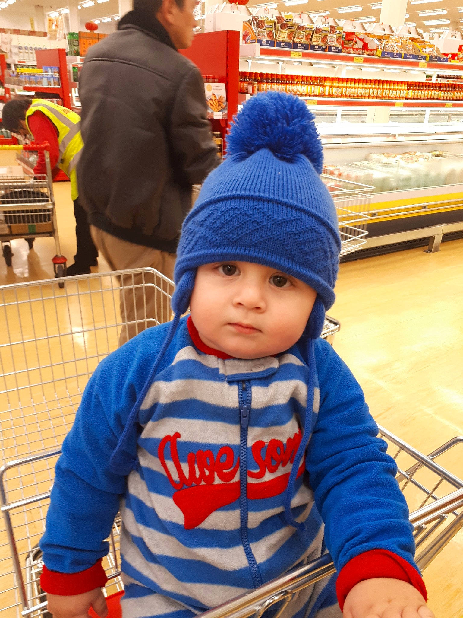 Alexandru is registered to the contest to win money with this photo: baby, beanie, blue, bonnet, cap, child, headgear, headwear, knit_cap, knitting, male, outerwear, people, person, retail, supermarket, toddler, tourism, vacation, vehicle