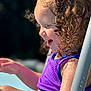 Kinley joined the competition — help win amazing prizes! child, toddler, curly_hair, purple_top, water_droplets, outdoor, sunlight, side_profile, happy, smiling, playing, summer, skin, person, closeup, fun, nature, daylight, young_child, casual_clothing