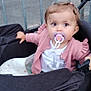 Mia participe au concours pour gagner de l'argent avec cette photo : baby, casual, child, curious, daylight, hand, metal_fence, outdoor, pacifier, person, pink_sweater, road, seat, sidewalk, stroller, toddler, toy, transport, urban, white_clothing
