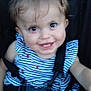 baby, car_seat, child, clothing, cute, face, hair_clip, happy, head, indoor, infant, person, portrait, seatbelt, sitting, smiling, straps, striped_clothing, toddler, young_child