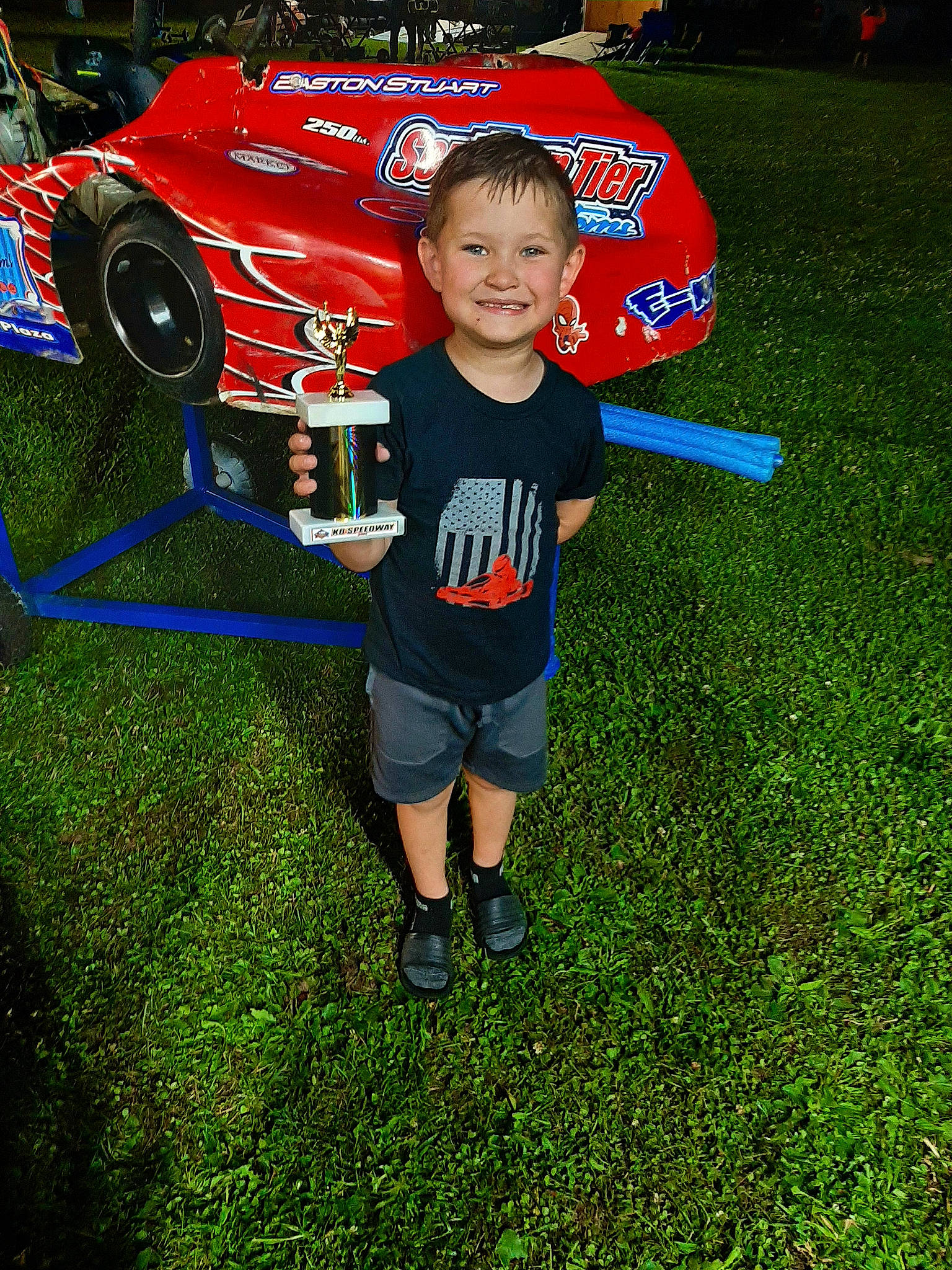 Easton joined the competition — help win amazing prizes! automotive_exterior, boot, bumper, competition_event, electric_blue, fun, grass, joy, leisure, motor_vehicle, person, personal_protective_equipment, player, recreation, shorts, smile, sportswear, t_shirt, team, tire