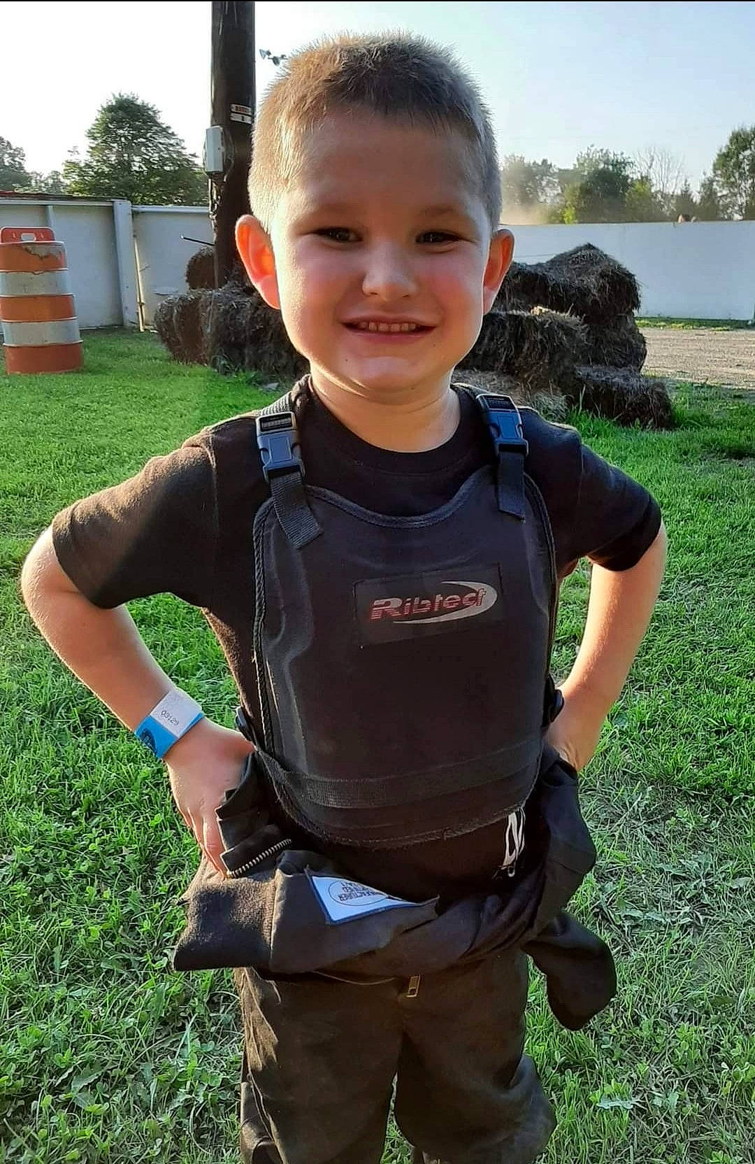 Easton joined the competition — help win amazing prizes! baby_toddler_clothing, electric_blue, eye, fun, gesture, grass, happy, joy, leisure, pattern, people_in_nature, person, personal_protective_equipment, plant, recreation, sky, sleeve, smile, t_shirt, thumb